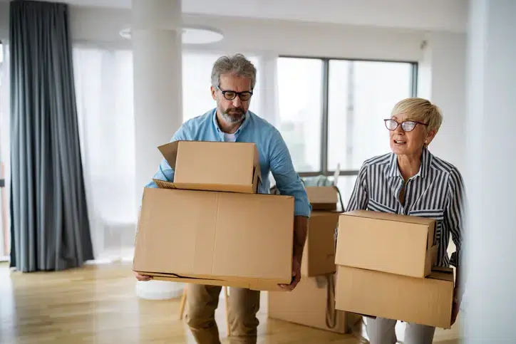 Portrait of happy smiling senior couple in love moving in new home