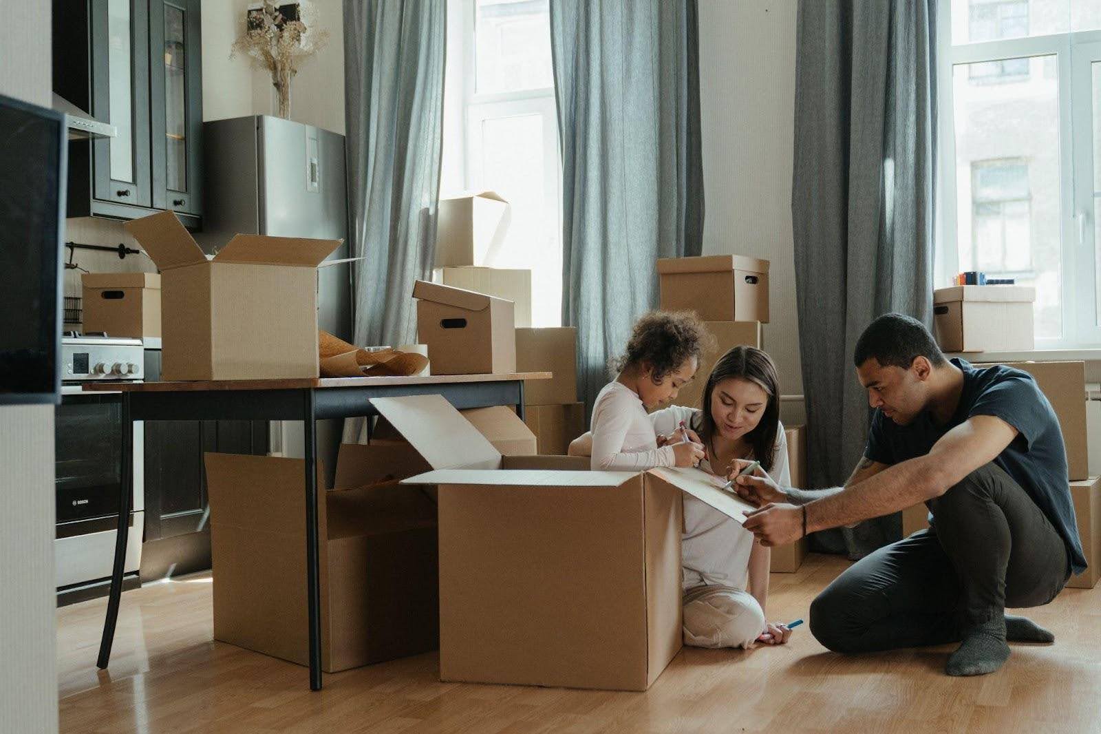 A family packing boxes getting ready for a move