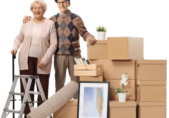 An elderly couple packing