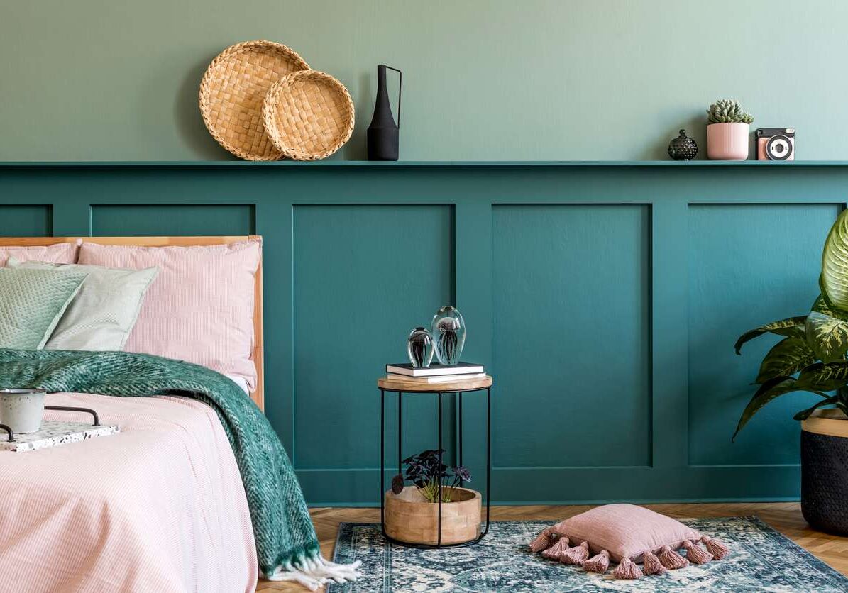 A staged bedroom with a green theme.