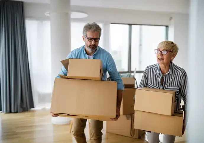 Portrait of happy smiling senior couple in love moving in new home