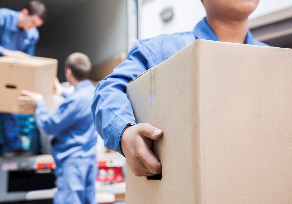 Movers unloading a moving truck.