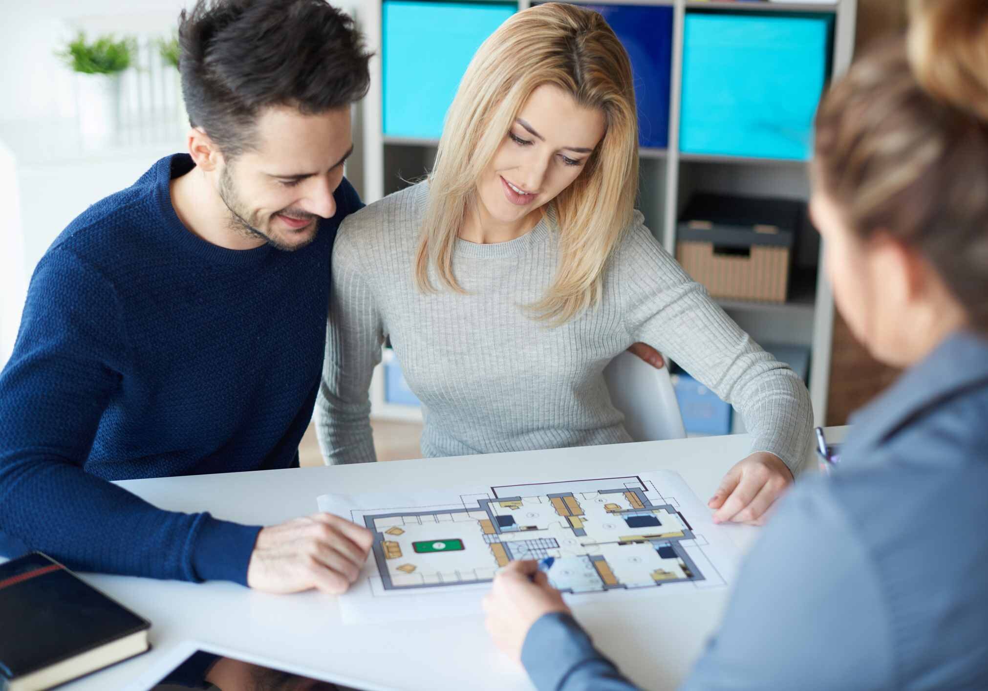 Couple meeting with real estate agent