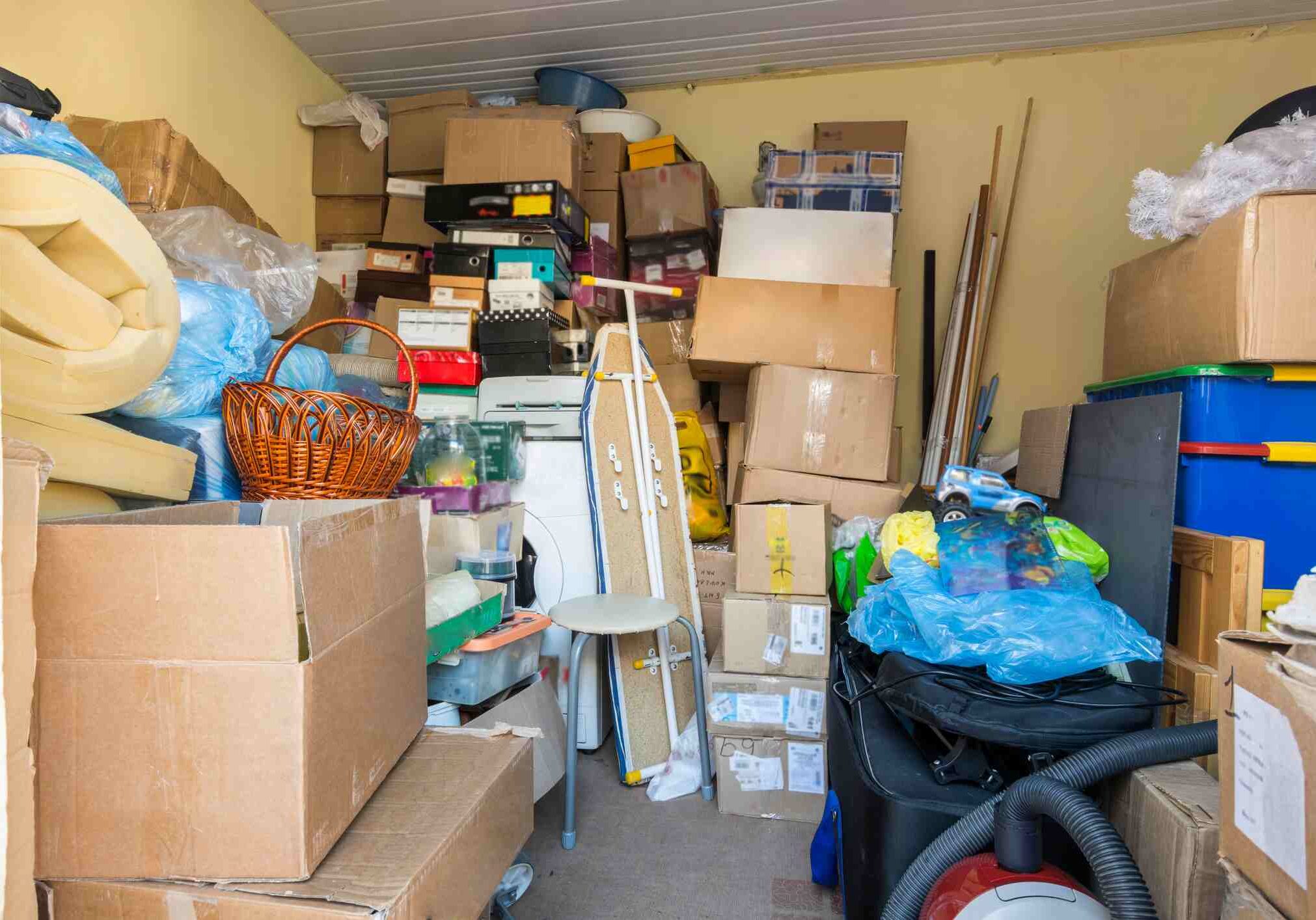 Moving, things packed in boxes and packages lie in a small room