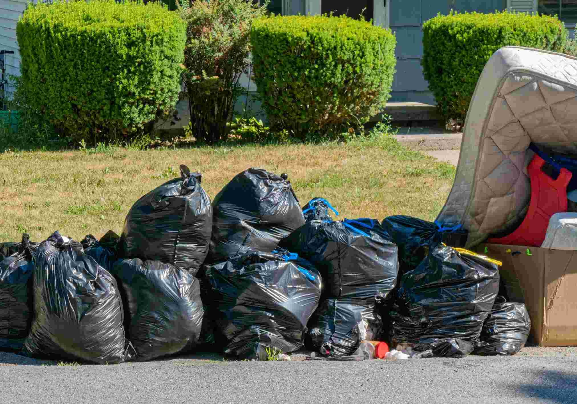 Garbage Bags and Trash waiting for garbage truck.